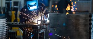 Masked welder working
