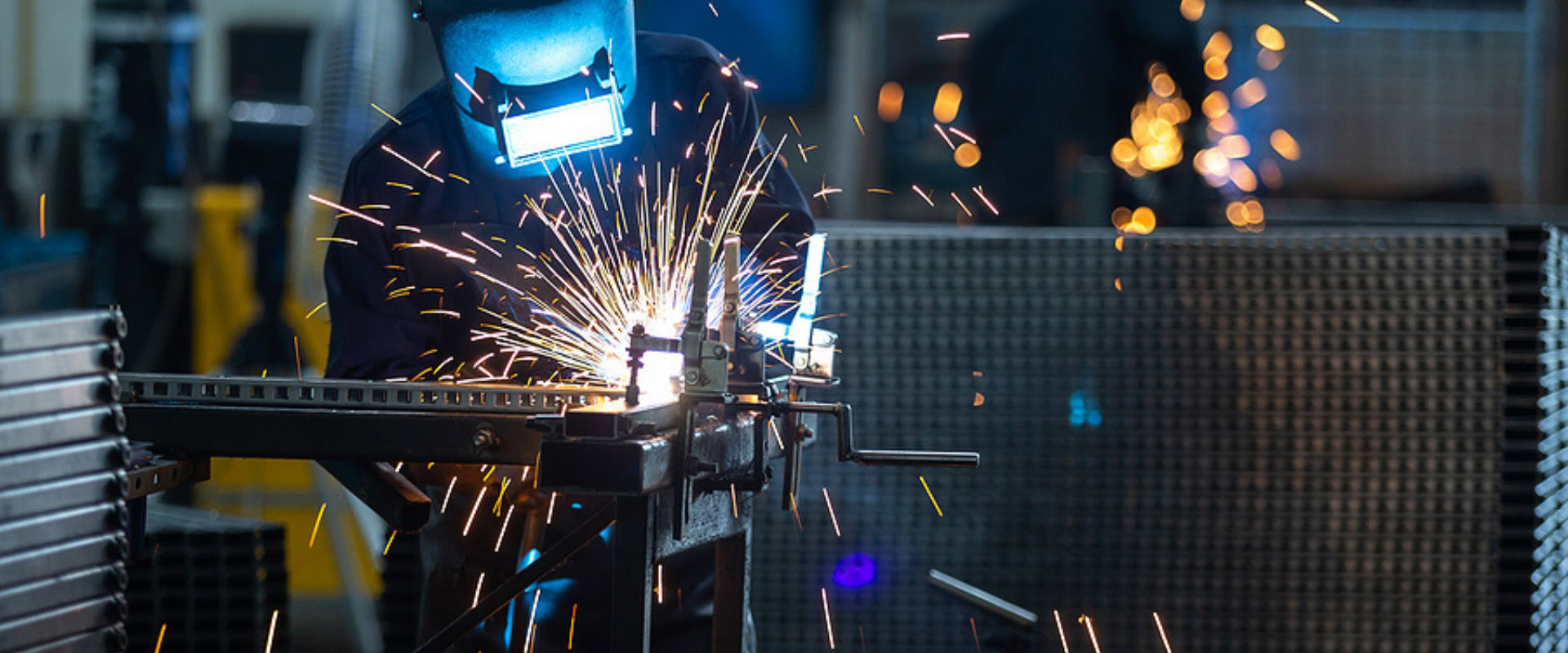 Masked welder working