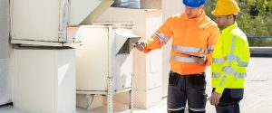 Environmental risk assessors testing a business to identify hazards.