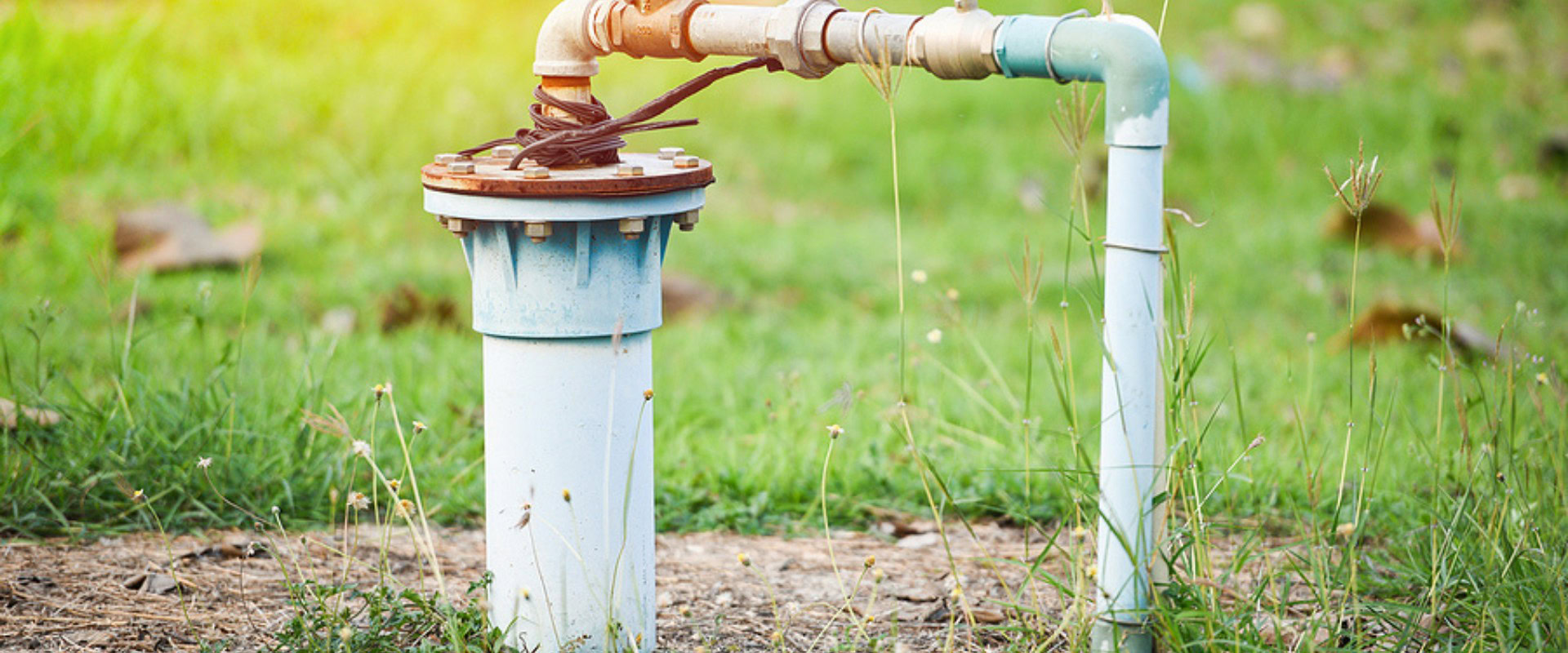 Well pump coming out of the ground.